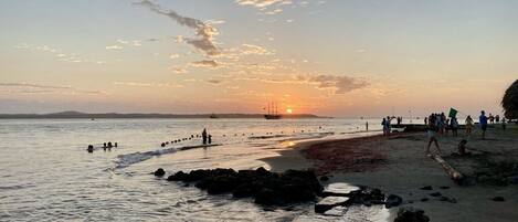 On the beach, sun loungers, beach towels