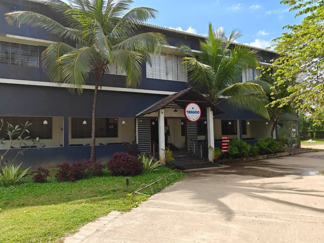 A building with a sign reading 'TANGO' and a covered entrance.
