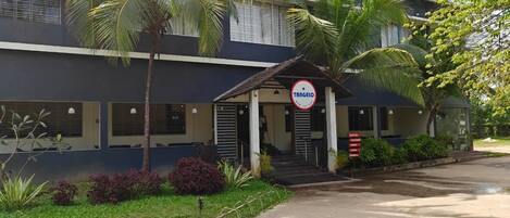 A building with a sign reading 'TANGO' and a covered entrance.