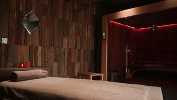 Cozy retreat with a large bed, bedside table, and mirror.