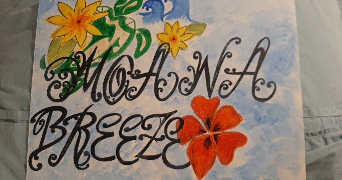 A hand-drawn sign with the text "MOHAWA BREEZE" surrounded by colorful flowers.