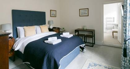 Luxury King bedroom with ensuite bathroom in a wing of a private Country House