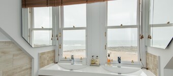 A 4-bedroom luxury holiday home with enchanting sea views across Milsey Bay Beach