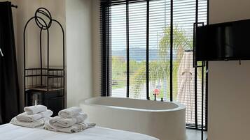 Honeymoon Room | Select Comfort beds, minibar, in-room safe, blackout drapes