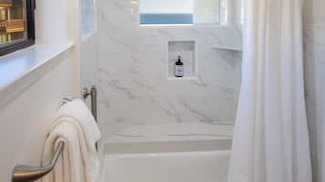 Bathtub, hair dryer, towels