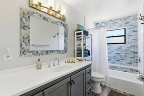 Bathtub, hair dryer, towels, soap