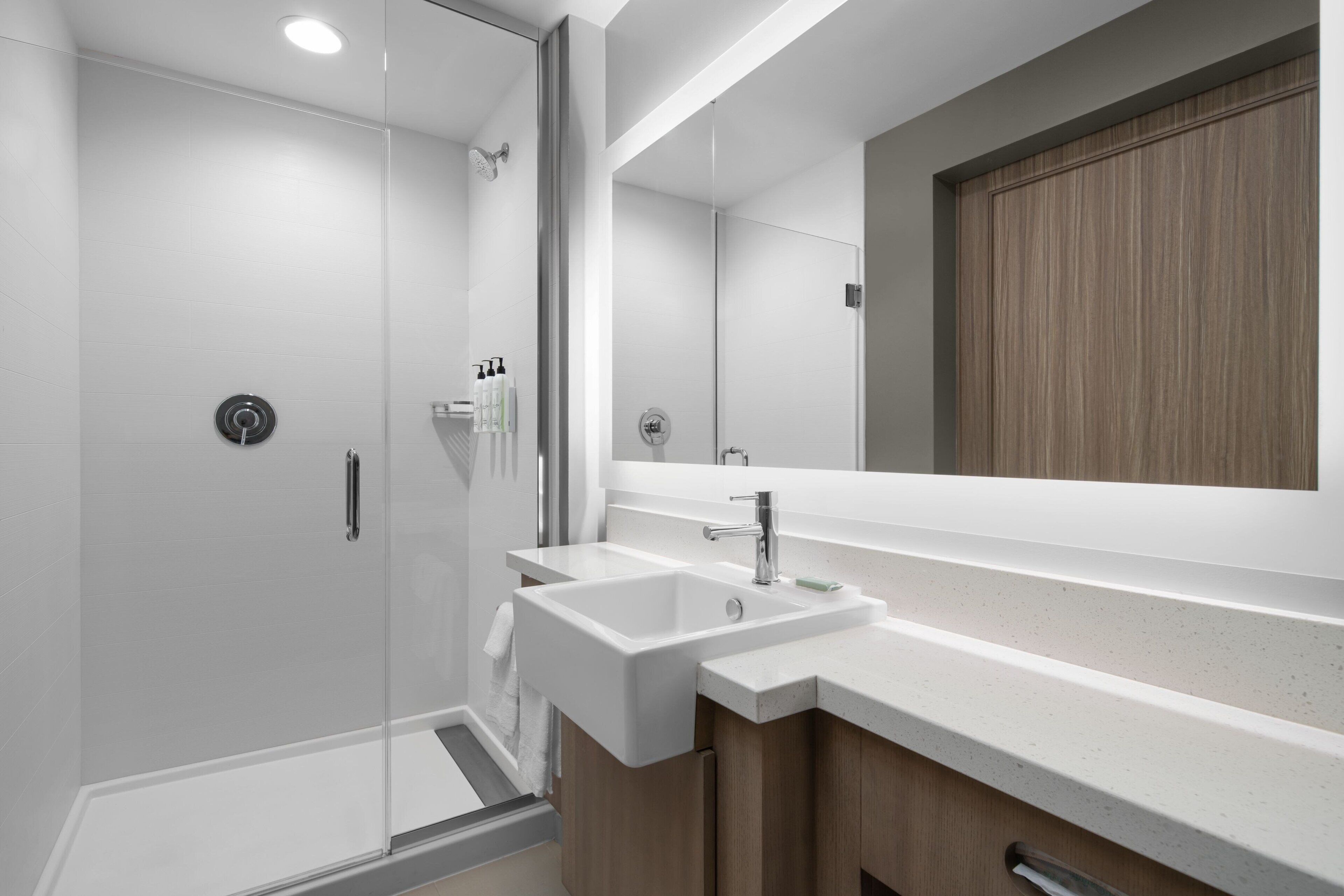 designer toiletries, hair dryer, towels, soap