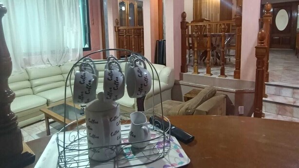 A living room with a coffee station, a sofa, and a staircase. - Beautiful house in private, a few minutes from downtown!!!! (Oaxaca de Juárez)