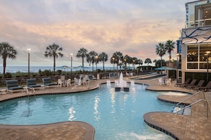 Outdoor pool, open 7:00 AM to 11:00 PM, pool umbrellas, pool loungers