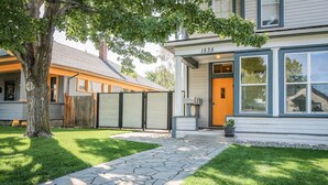 A two-story house with a stone pathway leading to the front door, number 1535. - Palmer House, Studio 2, Cozy Downtown Space, Sleeps 4! (Baker City)