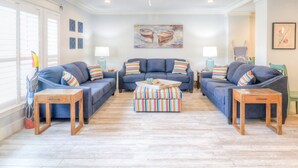 A living room with two sofas, a coffee table, and two side tables. - Stay 7+ Nights for 10% Off: Isla Breeze, Your Easeful Escape (South Padre Island)