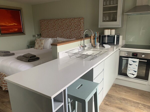 1 bedroom, desk, iron/ironing board, travel cot