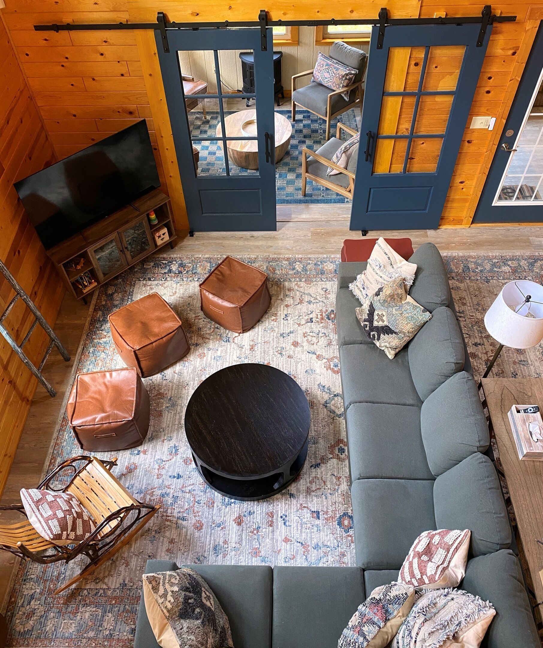 Smart TV, fireplace, books, computer monitors