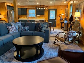 Smart TV, fireplace, books, computer monitors