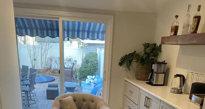 Modern Colonial with lemonade porch and backyard oasis with in-ground heated spa