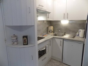 Fridge, microwave, toaster, cookware/dishes/utensils