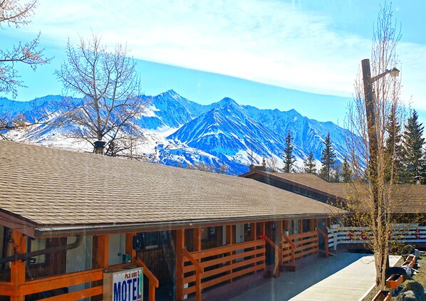 A wooden building with a sign reading "Motel" in front. - Cozy Corner Motel & Restaurant (Haines Junction)