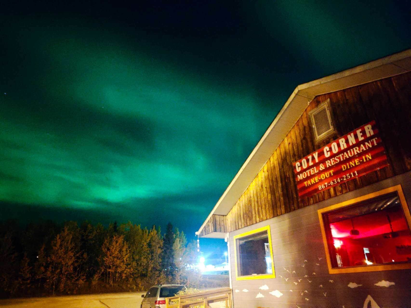 A building with a sign that reads "CODY CORNER MOTEL & RESTAURANT TAKEOUT DINE-IN."