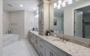 Combined shower/bathtub, towels, soap, toilet paper
