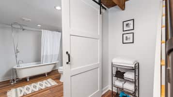 Bathtub, hair dryer, towels, soap