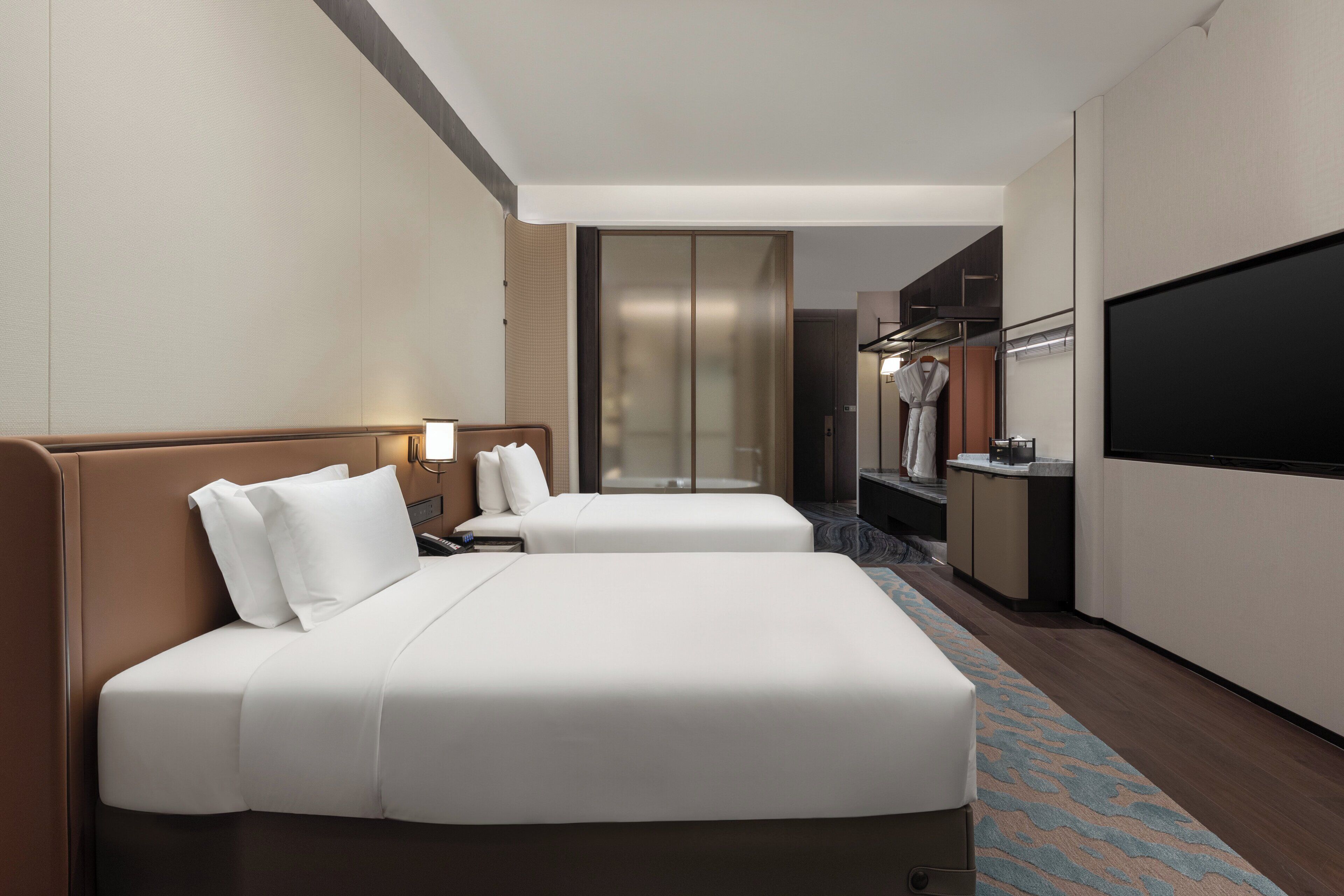 Premium bedding, down comforters, memory foam beds, free minibar items