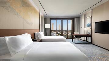 Premium bedding, down comforters, memory foam beds, free minibar items