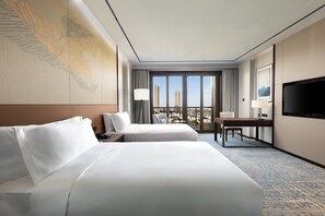 Premium bedding, down duvets, memory-foam beds, free minibar items