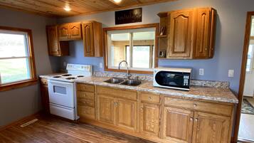 Fridge, microwave, cookware/dishes/utensils
