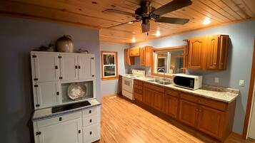 Fridge, microwave, cookware/dishes/utensils