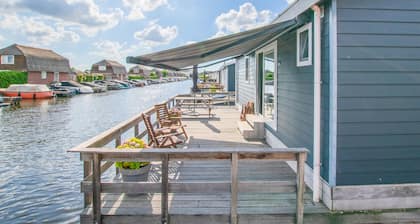 Modern chalet with private jetty on the water