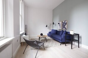 Relax in this stylish living room with a sofa, chair, and coffee table.