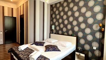 Hypo-allergenic bedding, down comforters, minibar, in-room safe