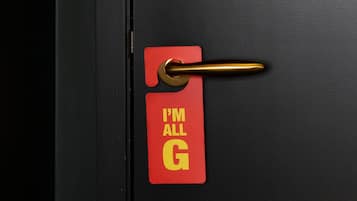 A door with a red tag that reads "I'm all G."