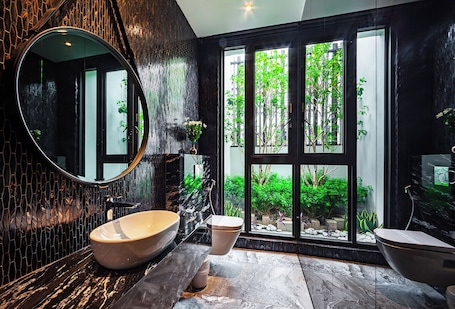 City Double Room (Karaoke) (Consecutive night 11 AM check-out required) | Bathroom | Separate tub and shower, rainfall showerhead, hair dryer, slippers. Norway Forest Motel - Wen Chuang Branch