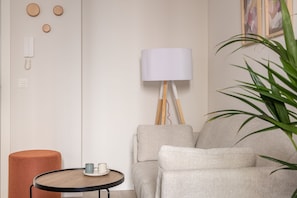 Studio, Balcony | Living room | Flat-screen TV