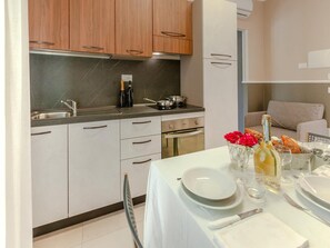 Fridge, oven, stovetop, dining tables