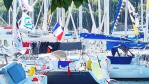 A marina with boats docked, surrounded by greenery. - House 300 metres from the beach (LOCTUDY)