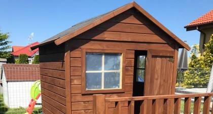 Half of holiday home, terrace, playground
