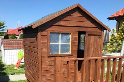 Half of holiday home, terrace, playground