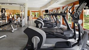A gym with treadmills, weight machines, and a mirror. - Villa La Estancia Unit # 2805 - B side Jr studio 2Q Beds Beach lux front resort. (Cabo San Lucas)