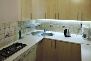 Fridge, stovetop, espresso maker, coffee/tea maker