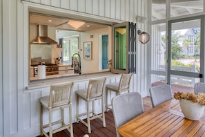 Enjoy a meal at the kitchen bar with a view of the outdoors.