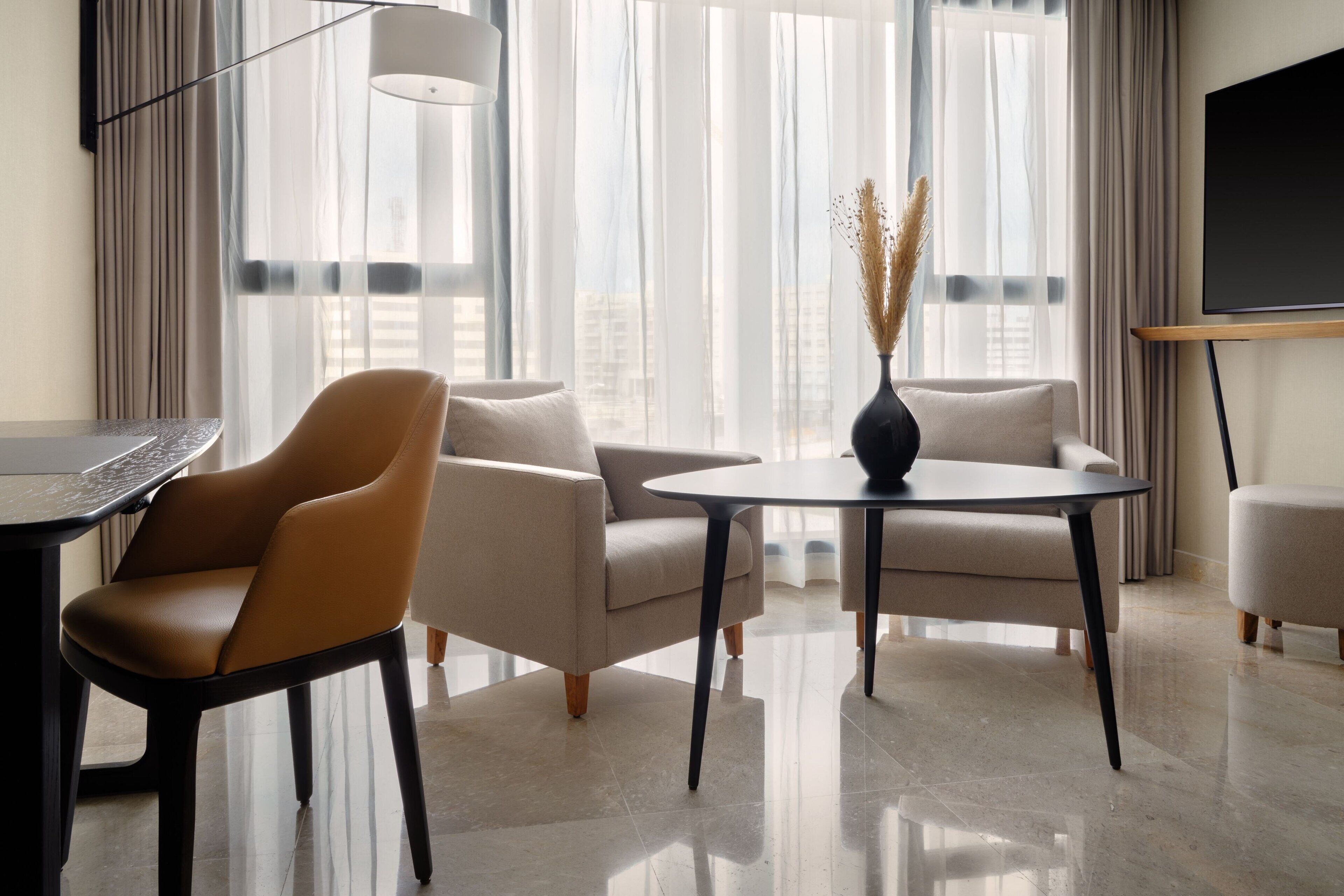 suite, 1 king bed, non smoking | living room | 55-inch lcd tv with satellite channels, tv, heated floors