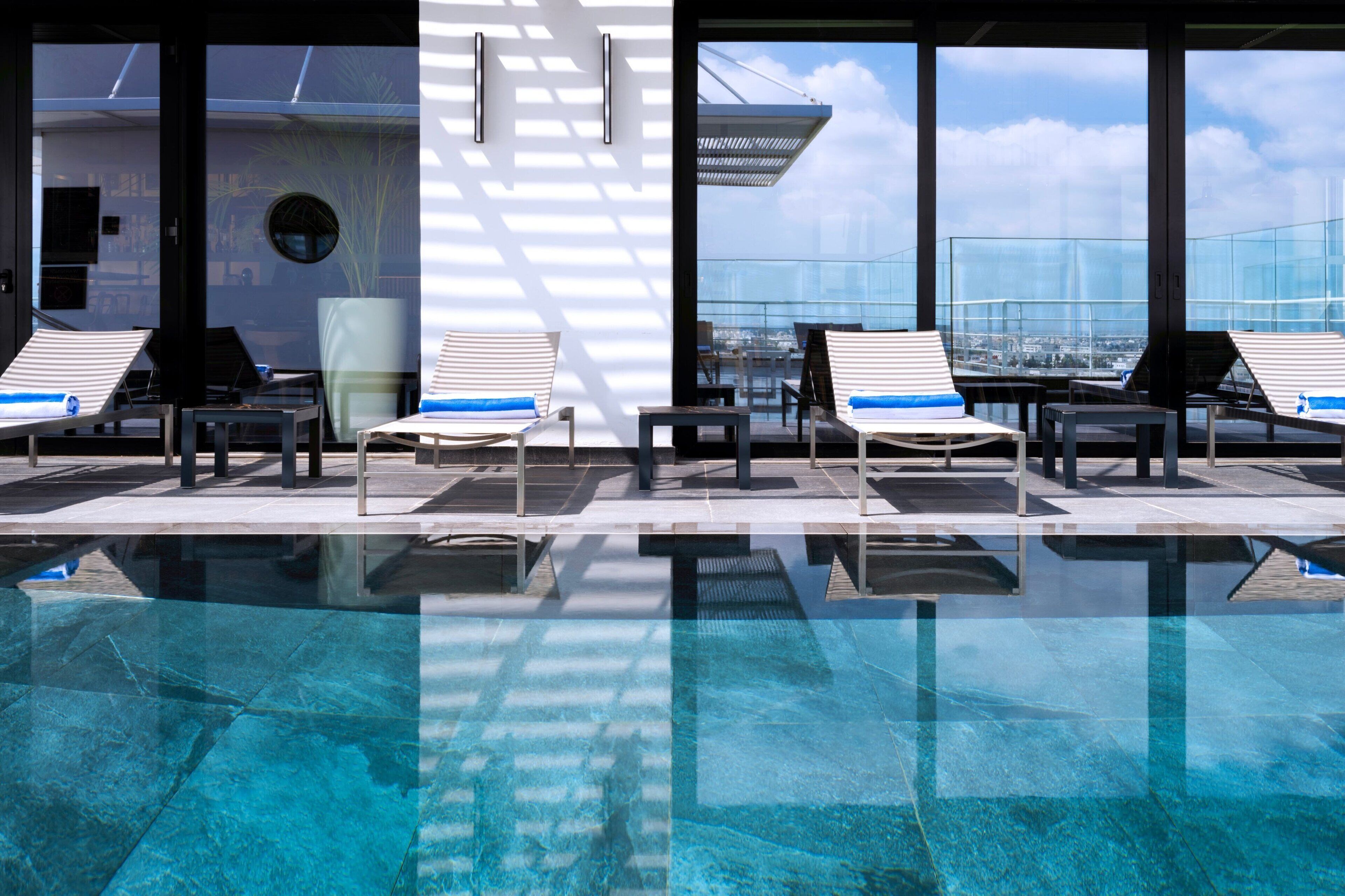 outdoor pool, open 10:00 am to 6:00 pm, pool umbrellas, pool loungers