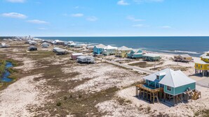 A coastal area with beach houses and a pier. - Elevator & Private Pool- Luxury 6 Bd, 6 Ba Home. Close to Beach w/amazing views (Gulf Shores)