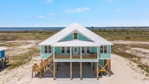 A beach house with a balcony, wooden deck, and a view of the ocean. - Elevator & Private Pool- Luxury 6 Bd, 6 Ba Home. Close to Beach w/amazing views (Gulf Shores)