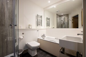 City Apartment, 1 King Bed with Sofa bed, City View | Bathroom | Separate tub and shower, rainfall showerhead, free toiletries