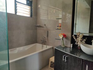 Bathtub, hair dryer, towels, soap