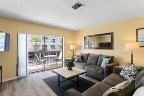 TV, DVD player - 🌴 Surf Song #237 — King Bed Comfort with Gulf Breezes & Walkable Charm (Madeira Beach)