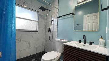 Bathtub, hair dryer, towels, soap